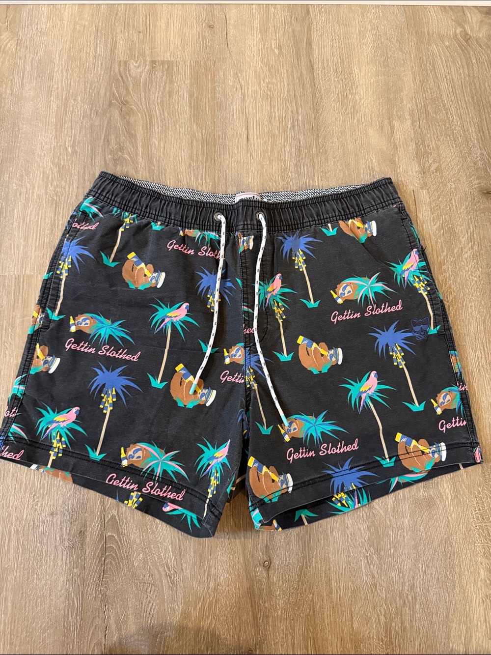 Men's Black Tropical Sloth Print Swim Trunks